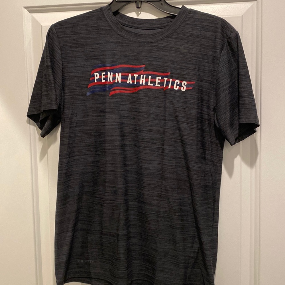 Small Dark Grey heathered Nike Dri Fit Penn Athletics shirt. Good condition.